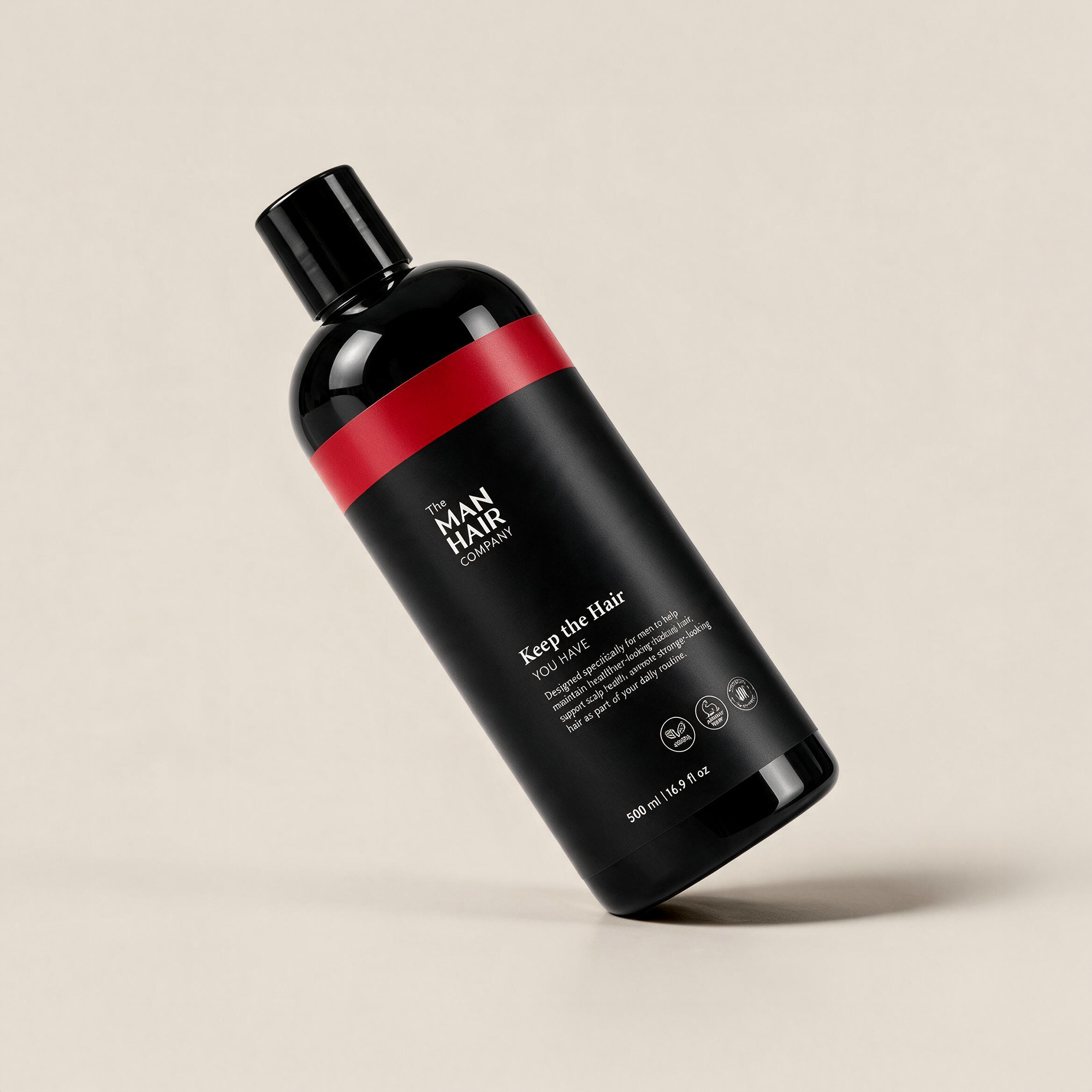 The Man Hair Shampoo bottle, tilted angle