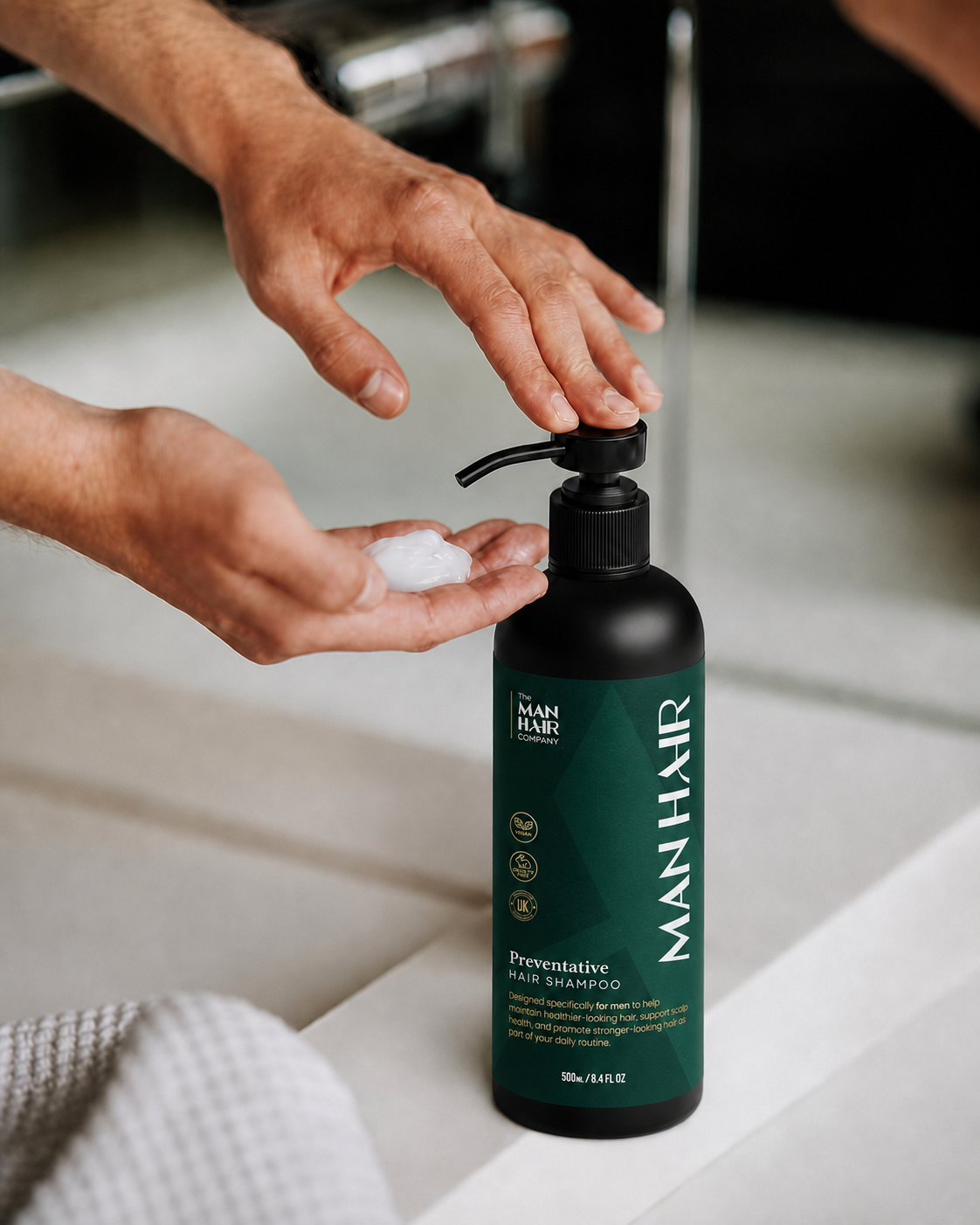 How to use The Man Hair anti-dandruff shampoo — man applying shampoo to hand from pump bottle